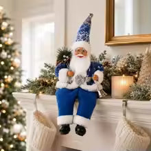 papai noel sentado azul na lareira