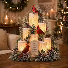 centro de mesa de natal com cardeais vermelhos e velas acesas