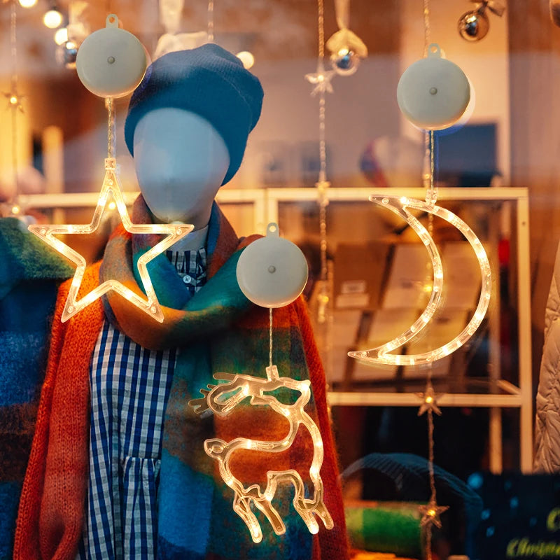 enfeites luminosos de natal com ventosa em vitrine de loja