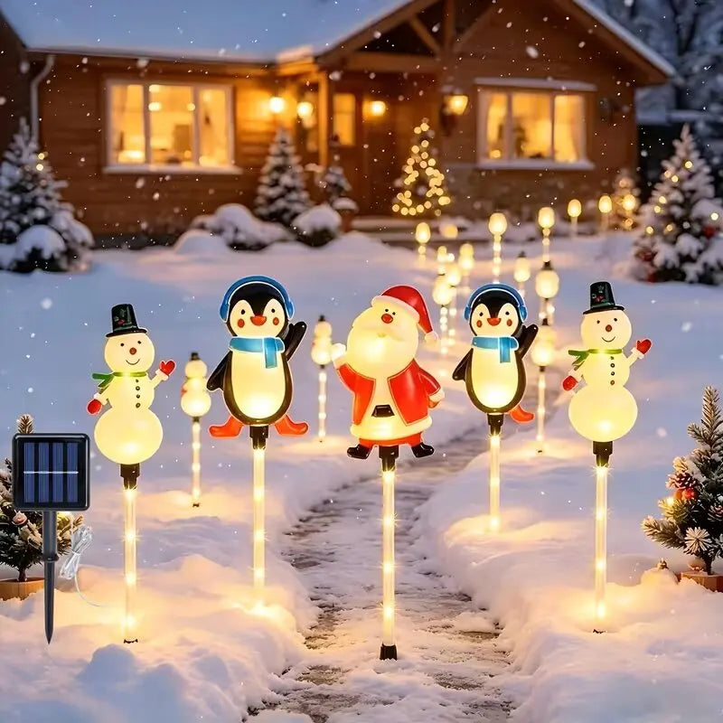 estacas solares de natal papai noel pinguins e bonecos de neve na neve