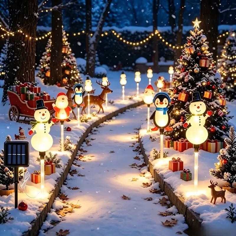 luz solar de natal para jardim ao lado da árvore iluminada