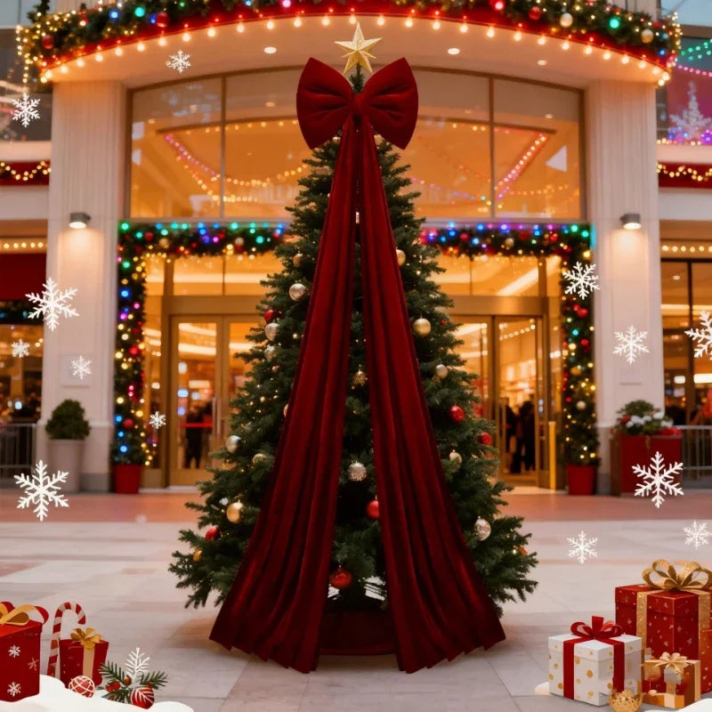 laço vermelho grande no topo da árvore de natal