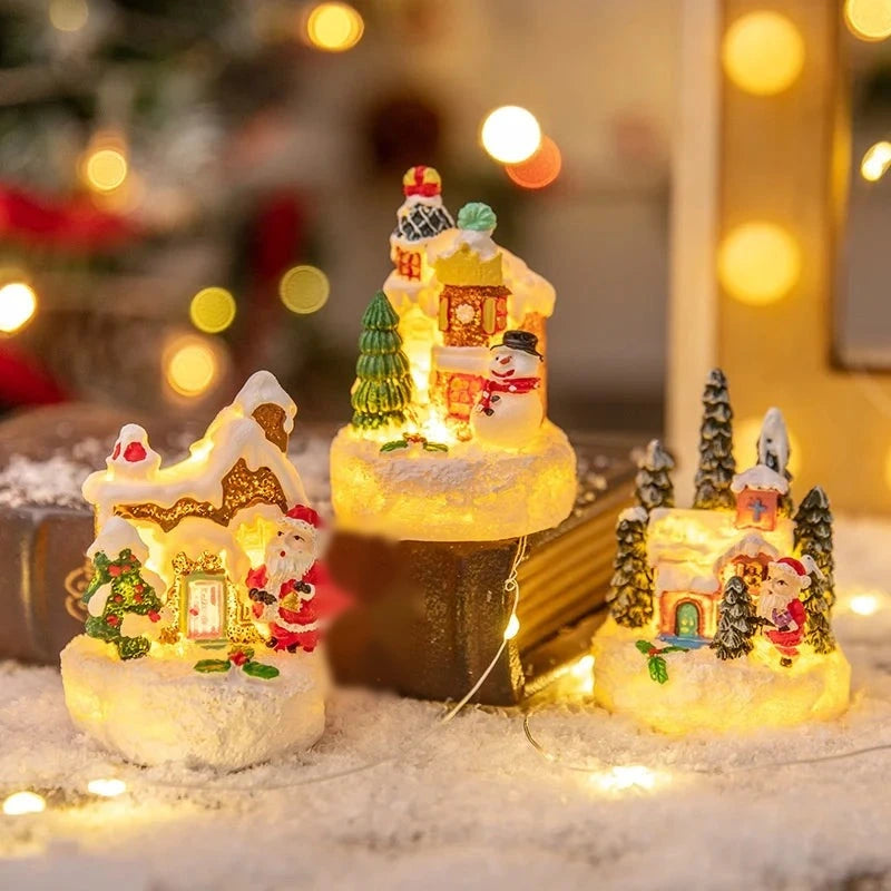 casinhas de natal iluminadas em resina sobre livro antigo
